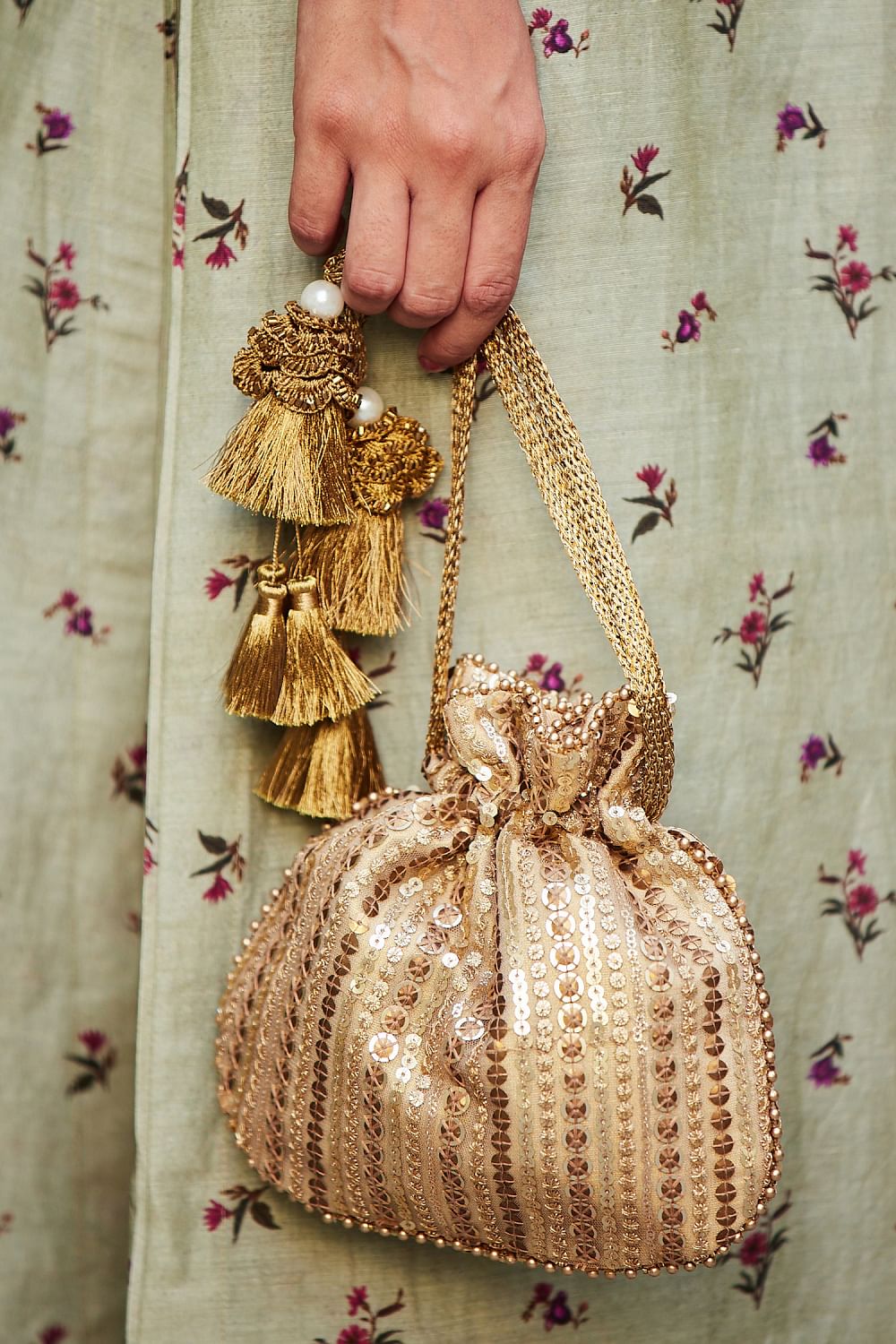 Buy Antique gold sequin embroidery potli bag by Amyra at Aashni and Co