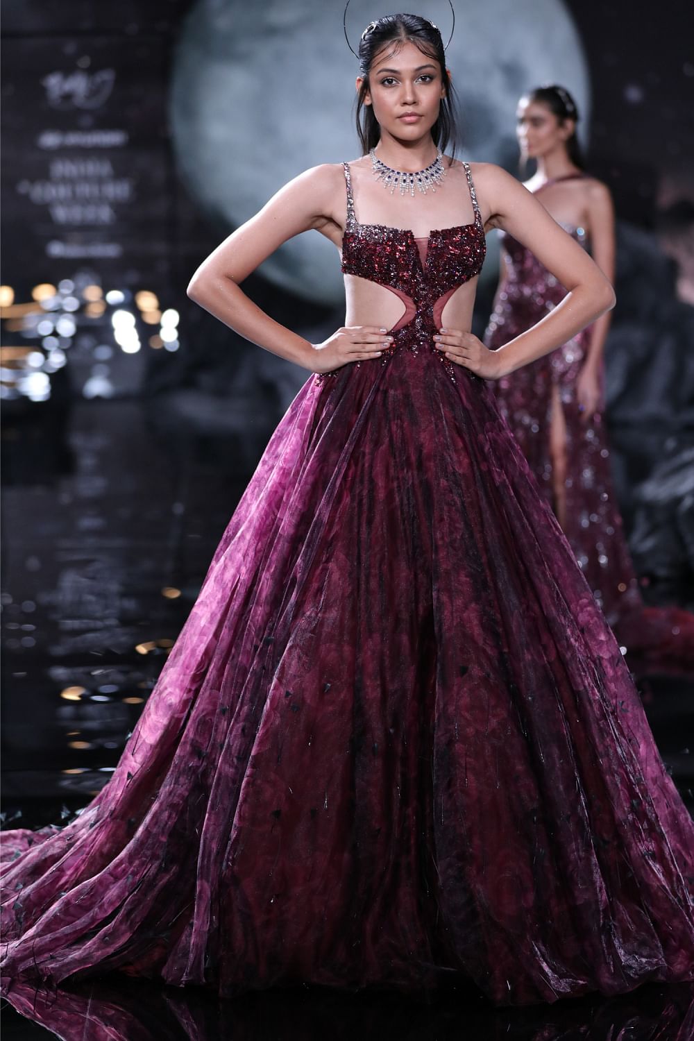 Maroon and 2025 black gown