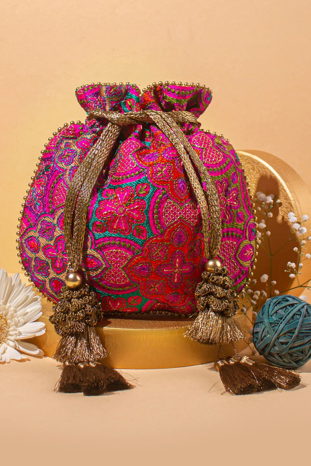 Buy Pink floral embroidery potli bag by Amyra at Aashni and Co