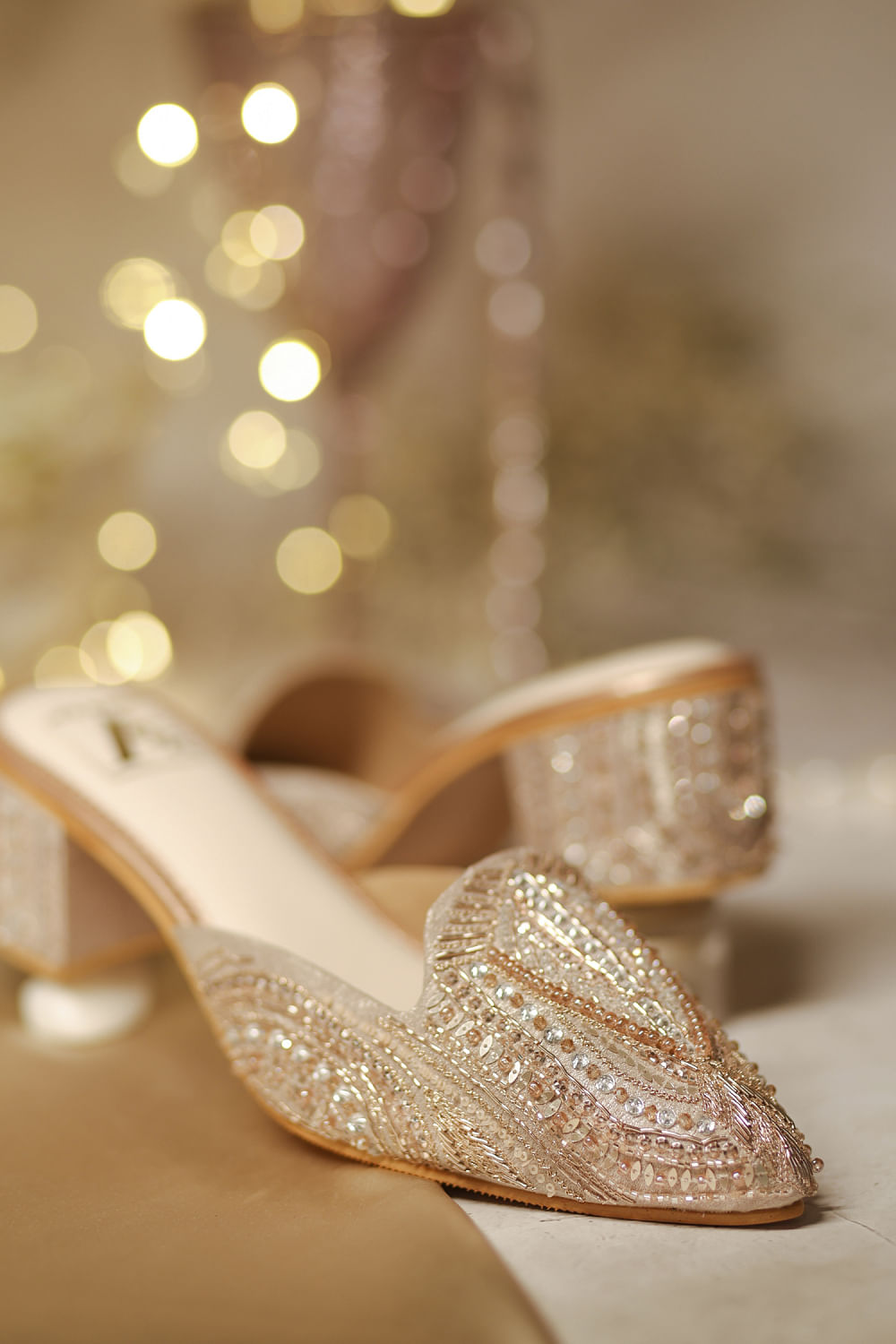 Buy Rose gold crystal embellished mule heels by House Of Vian at