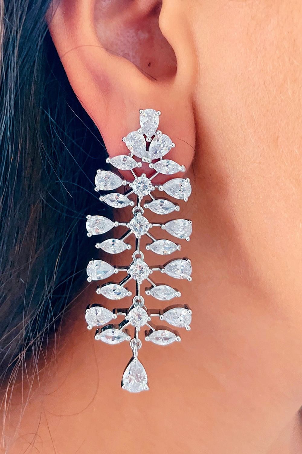 Buy Silver Swarovski embellished danglers by Prerto at Aashni and Co