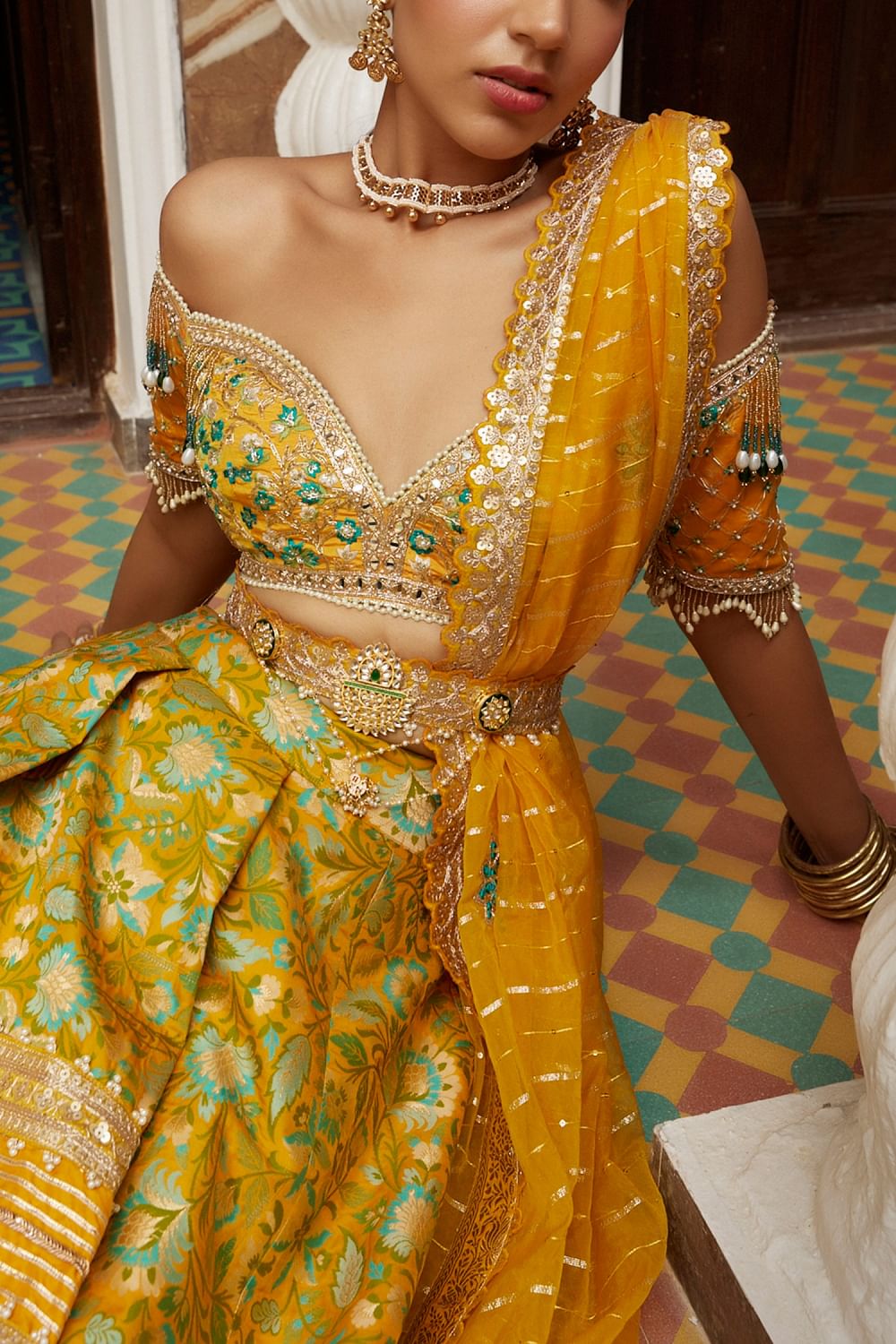 Buy Yellow floral patola jamawar lehenga set by Aditi Gupta at