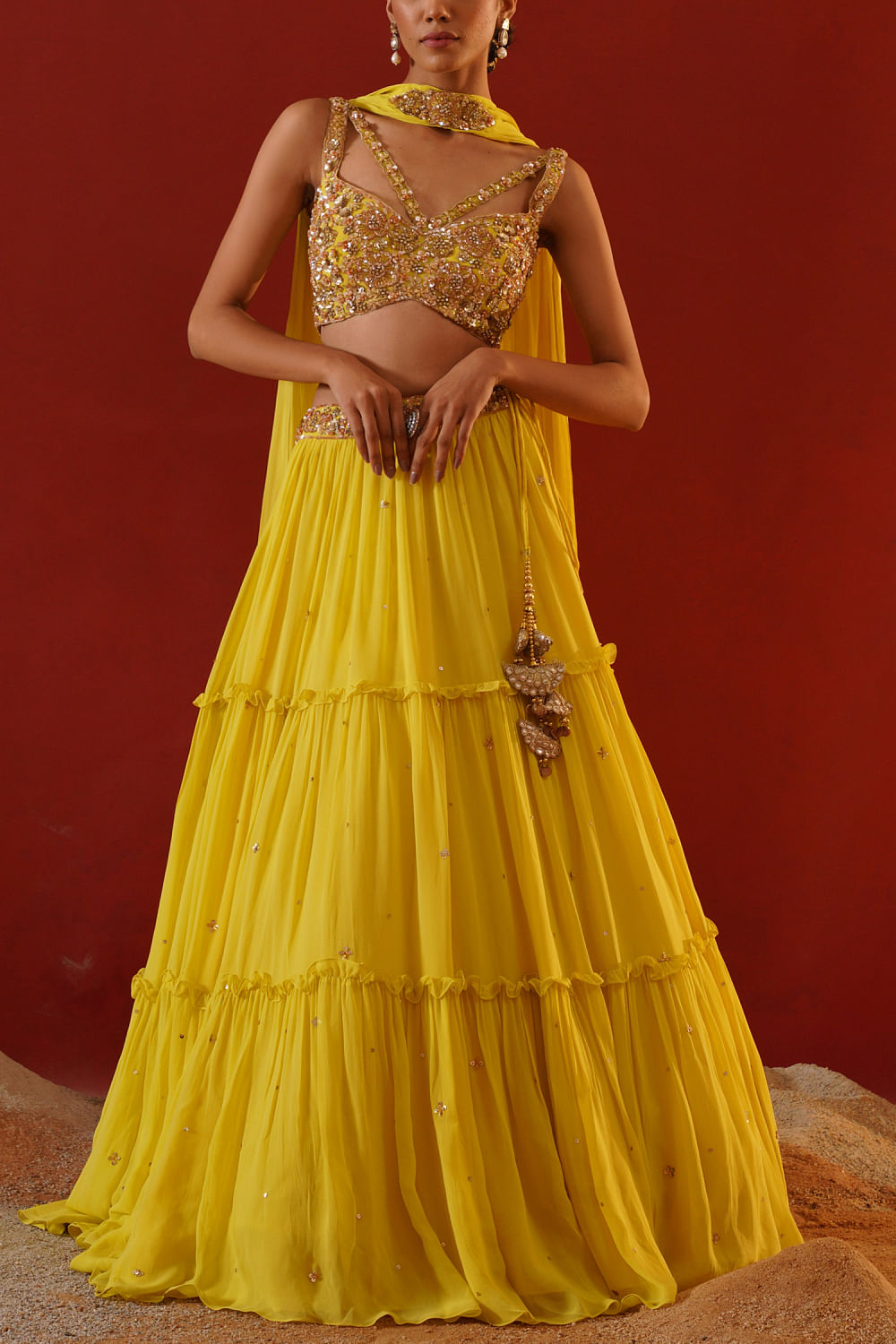 Buy Yellow hand embroidered lehenga set by Kapda Dori at Aashni and Co