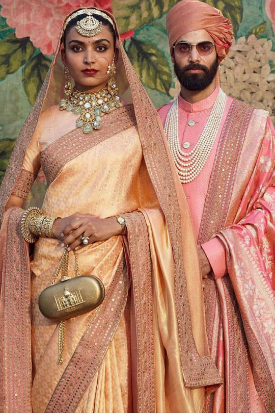 Indian Bride And Groom In A Coordinated Maroon Velvet Wedding Lehenga And  Sherwani | Indian wedding lehenga, Indian bride and groom, Indian bride